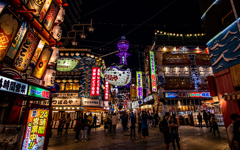 Shinsekai neighbourhood with Tsutenkaku Tower in Osaka, Japan